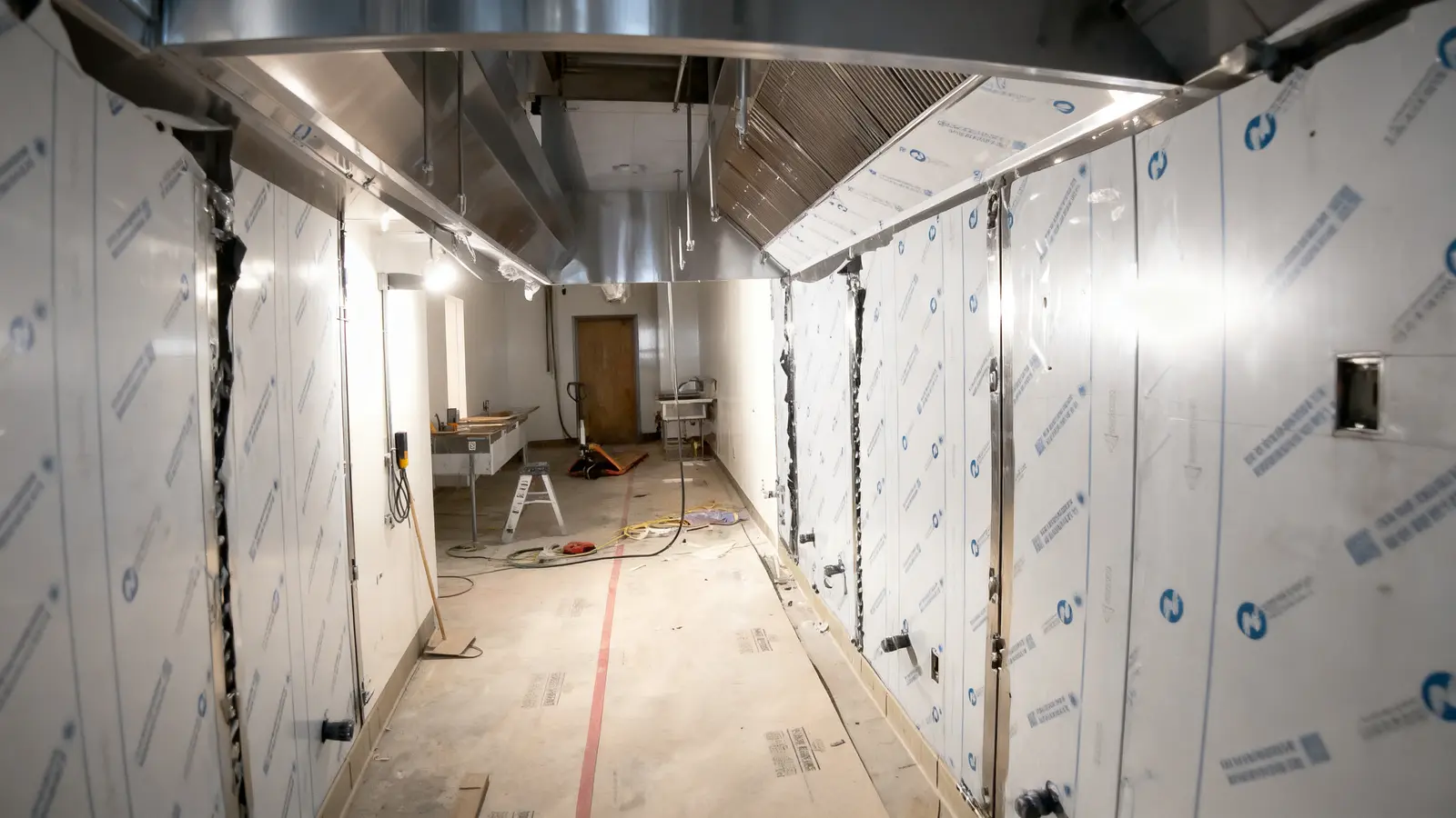 Commercial kitchen stainless steel fabrication with exhaust hood